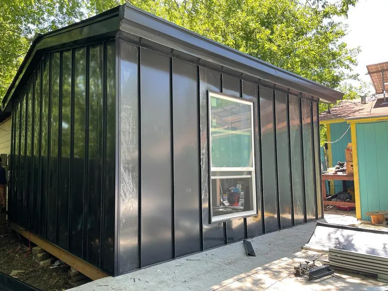 Black standing seam metal wall panels for Roof Inspection in La Porte